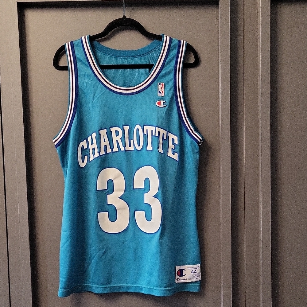 Adult L Charlotte Mouring Blue Basketball Jersey. Features Champion ans NBA Logo